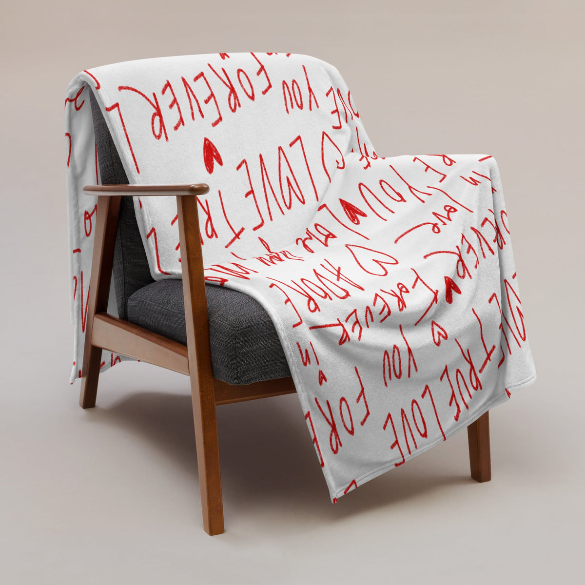 White love letter blanket with red handwritten style love you forever text and small heart symbols on soft fabric