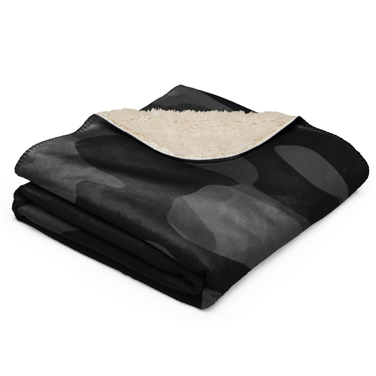 Black camo blanket with black and gray camouflage throw and plush cream sherpa lining for cozy warmth