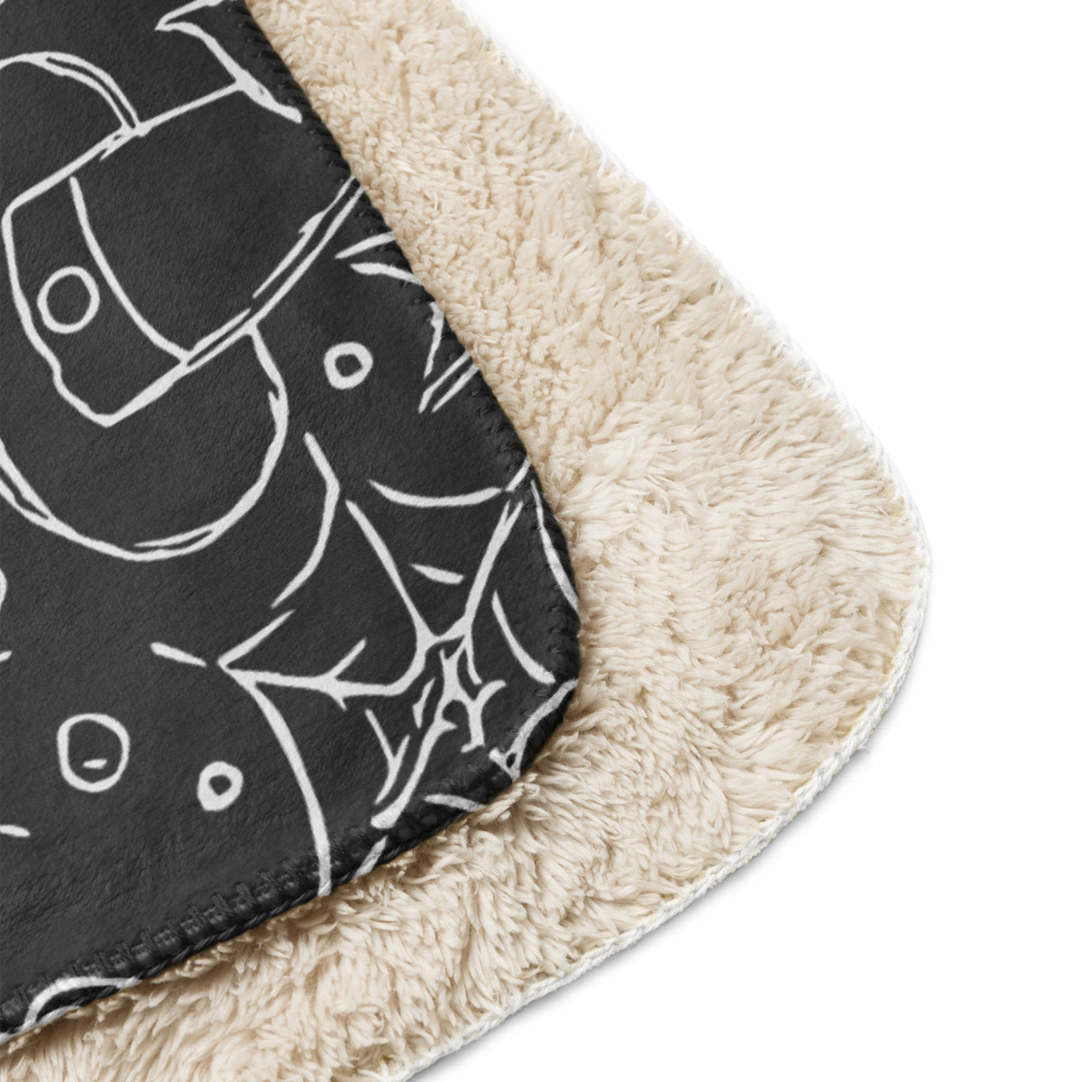 Black halloween blanket sherpa material in black and cream with white line drawn halloween illustrations