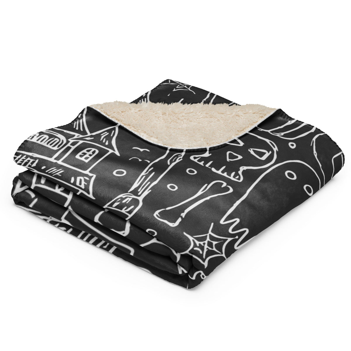 Black Halloween blanket with white chalkboard skulls bones and haunted houses and plush cream sherpa lining