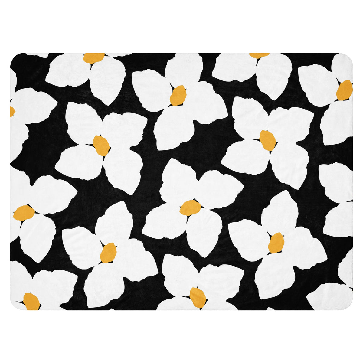 Black bath mat with repeating white flowers with yellow centers pattern for the black and white floral blanket collection