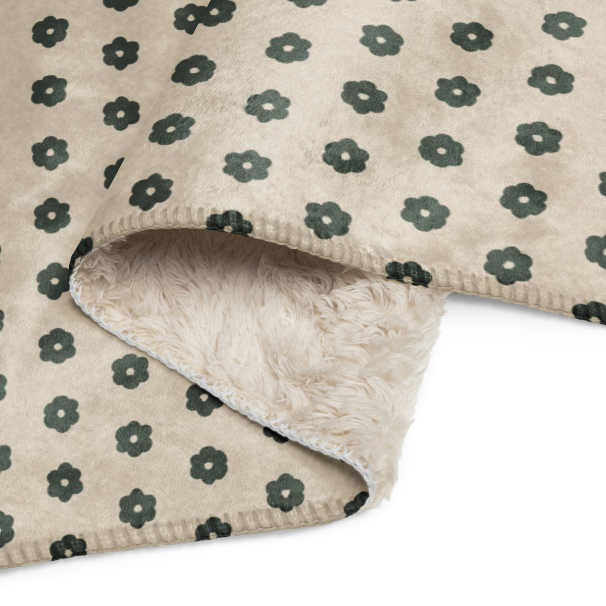 Beige boho floral blanket with dark green floral pattern and plush soft fleece interior for cozy comfort