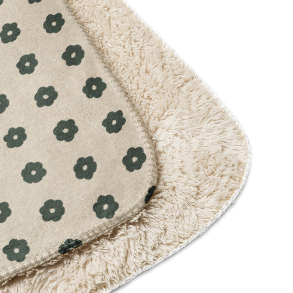 Beige plush boho floral blanket with dark green pattern and soft fuzzy texture perfect for cozy use