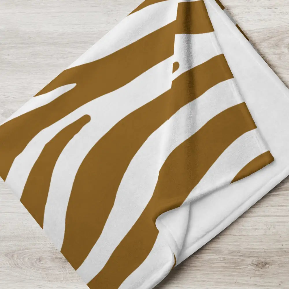 Couverture douce en peluche avec imprimé zèbre blanc et brun caramel pour une ambiance chaleureuse