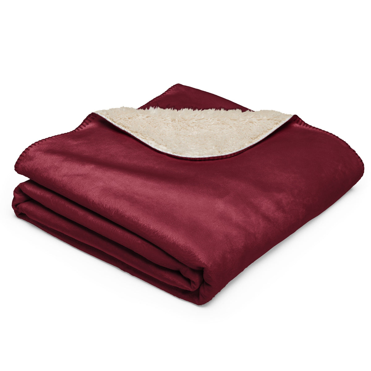 Burgundy sherpa blanket with maroon plush exterior and soft cream-colored sherpa lining for warmth and comfort