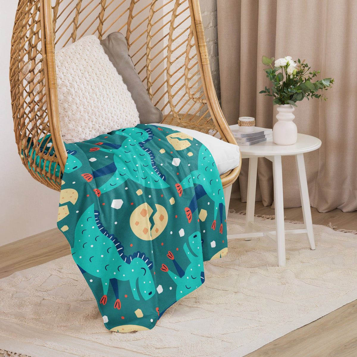 Dinosaur sherpa blanket showing the dinosaur print and the plush sherpa reverse side