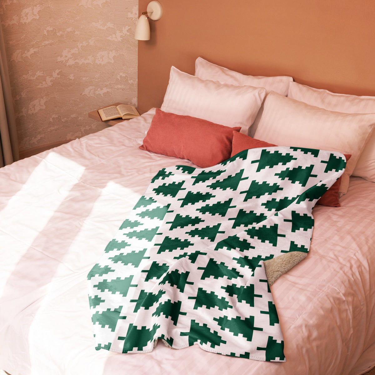 White blanket with green pixelated christmas tree pattern perfect for festive holiday decor