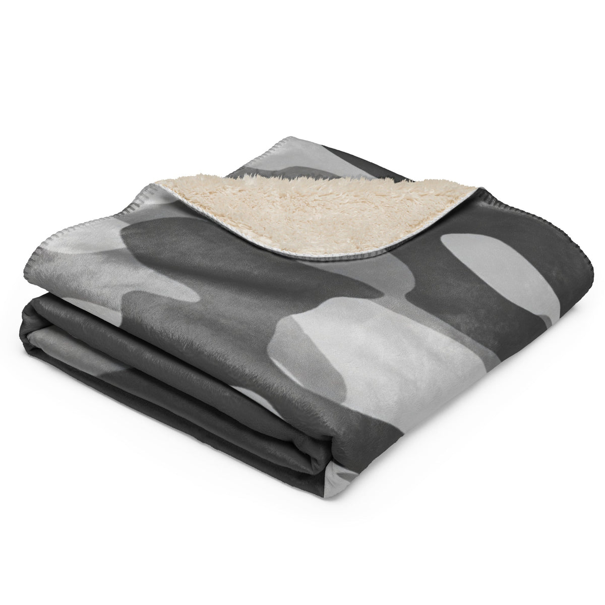 Grey camo blanket with cozy gray camouflage exterior and plush cream-colored fleece interior for warmth and comfort