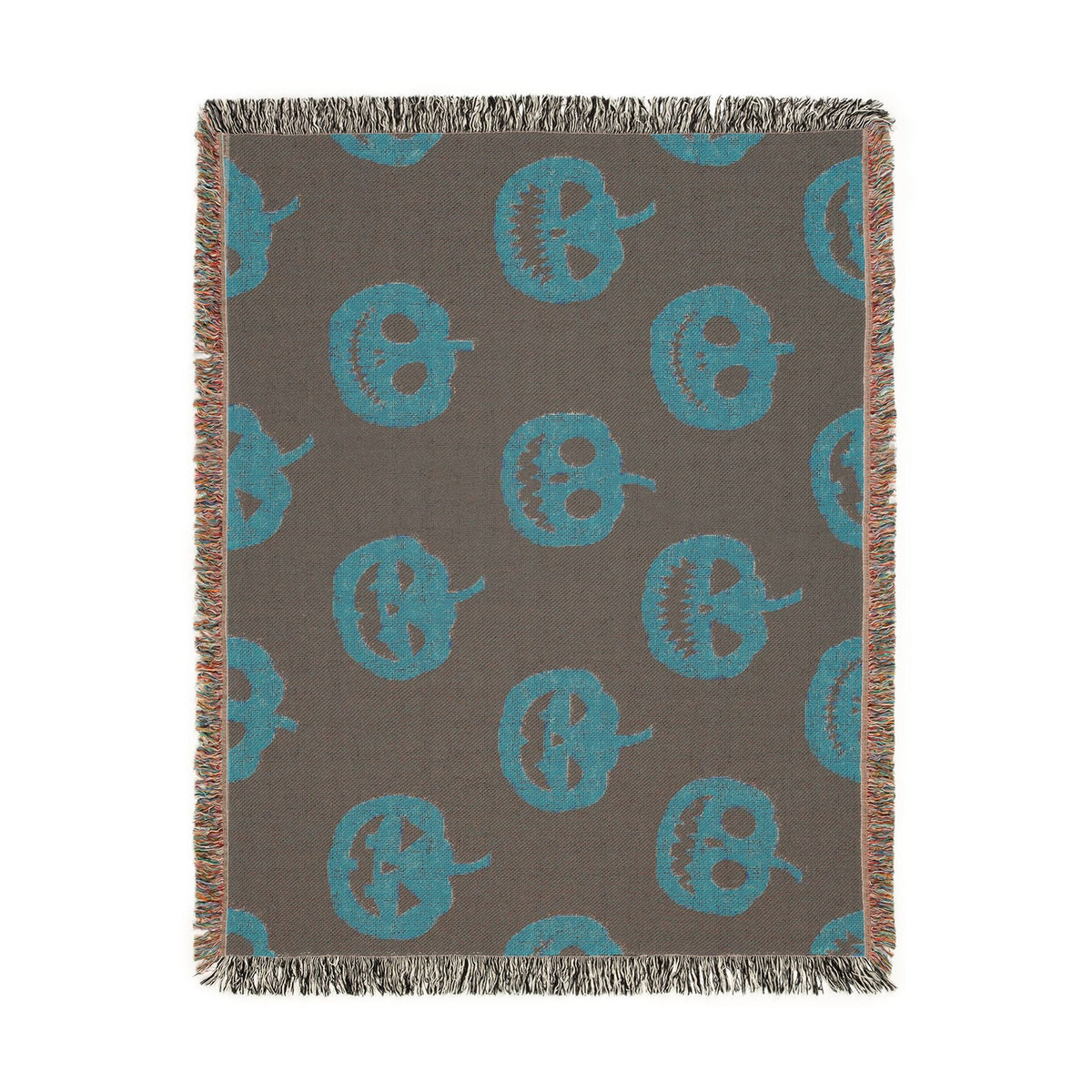 Gray woven throw blanket with turquoise jack o lanterns and fringed edges perfect for halloween decor
