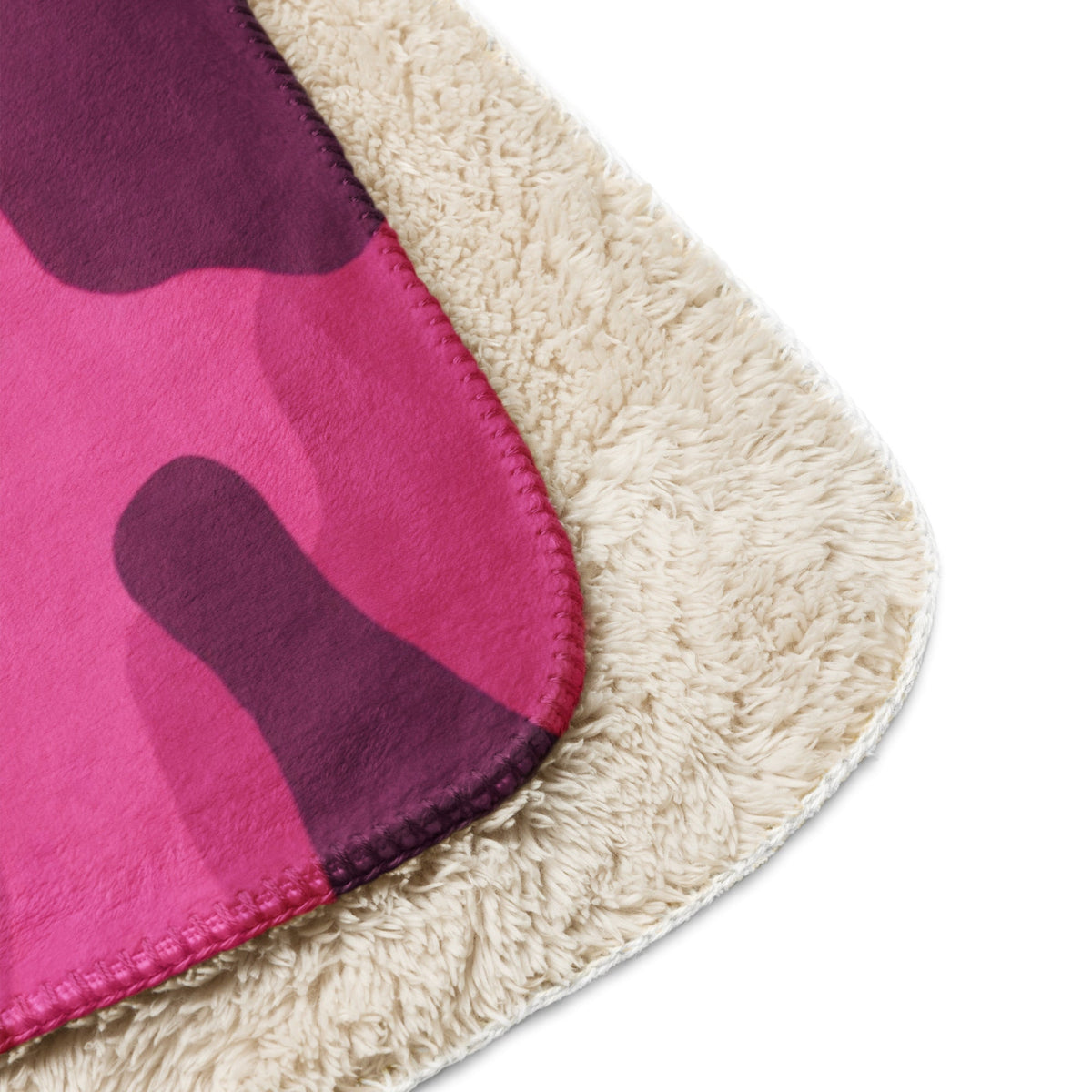 Hot pink camo blanket with pink and purple camouflage fleece and plush cream sherpa lining for warmth and comfort