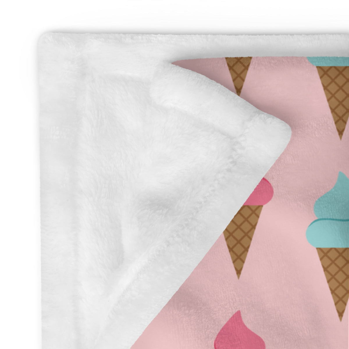 Ice cream cone blanket patterned with pink and teal fleece and a soft white plush lining for cozy warmth