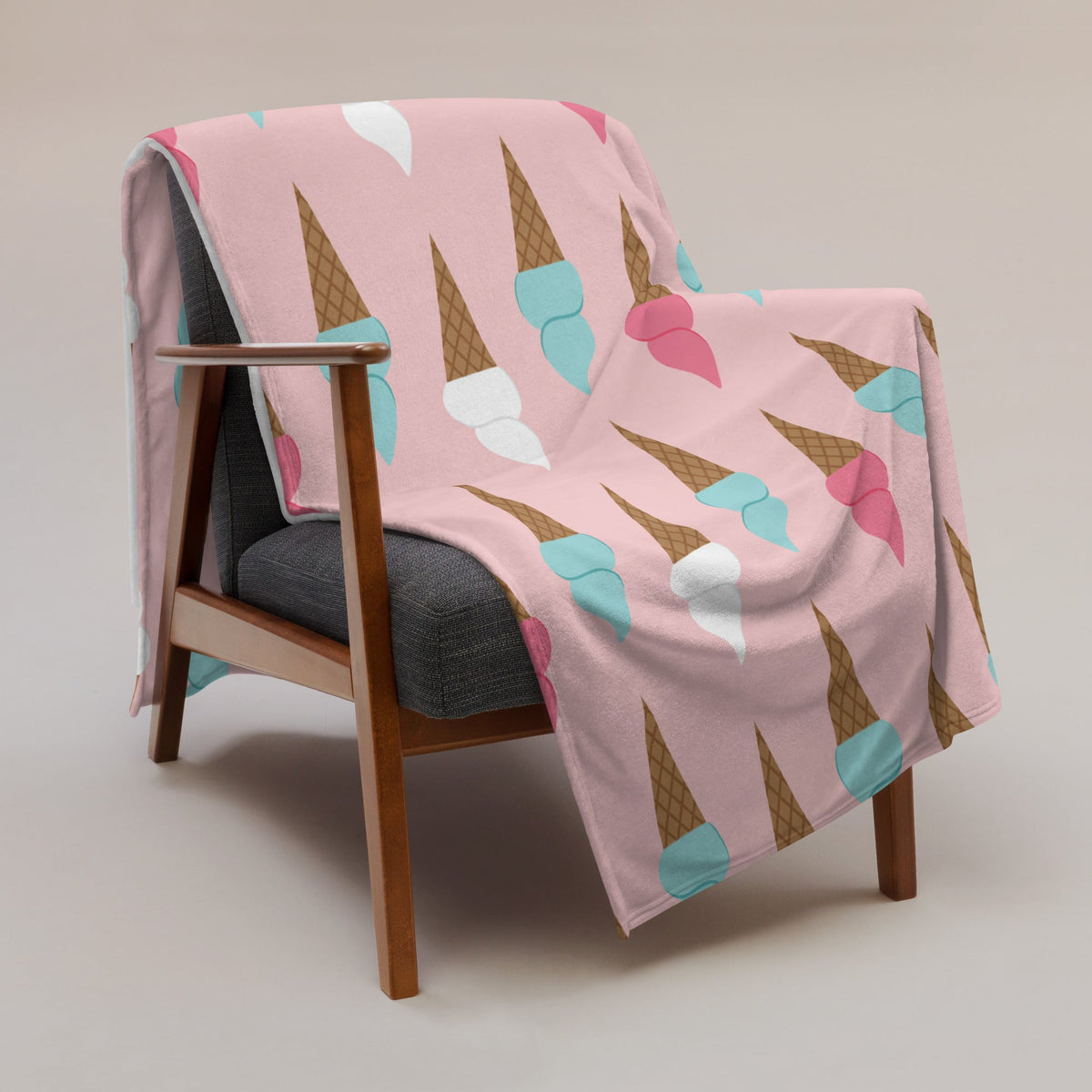 Pink ice cream cone blanket with repeating brown light blue and pink cone pattern for cozy warmth