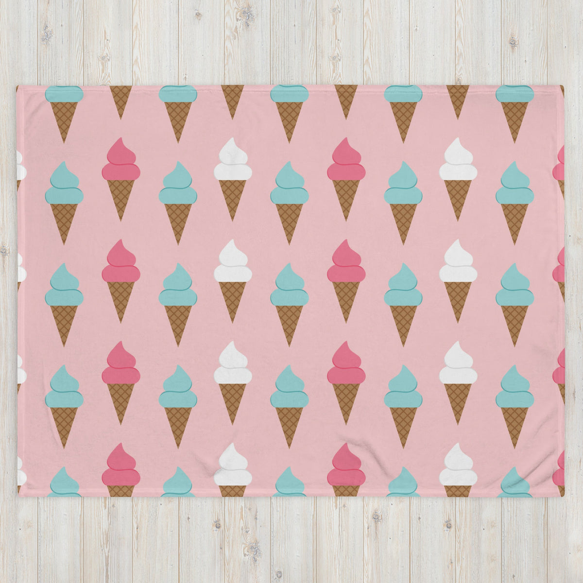 Pink ice cream cone blanket with teal pink and white cartoon swirl cones on brown waffle cone pattern