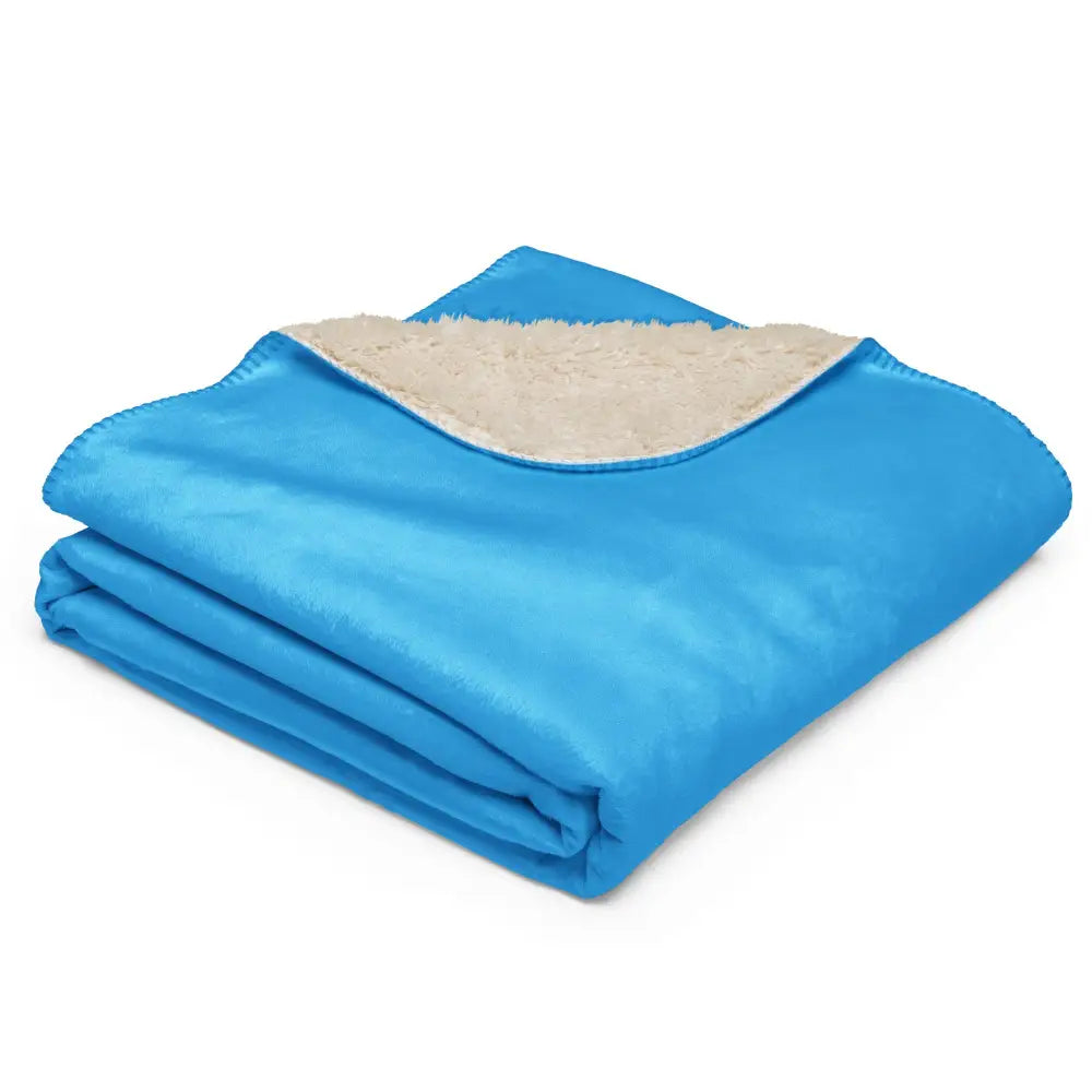 Light blue sherpa blanket with bright blue fleece front and plush beige sherpa lining for warmth and comfort