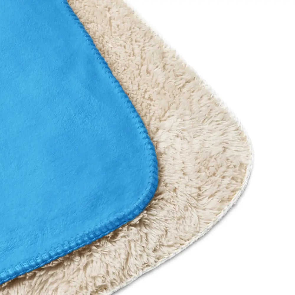 Blue and cream-colored plush microfiber cleaning cloths with a soft textured surface for light blue sherpa blanket care