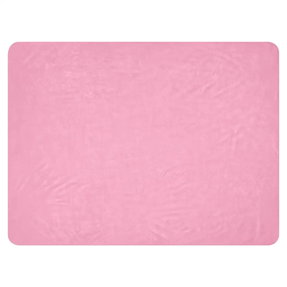 A soft pink sherpa blanket with a textured, slightly crinkled surface perfect for cozy warmth