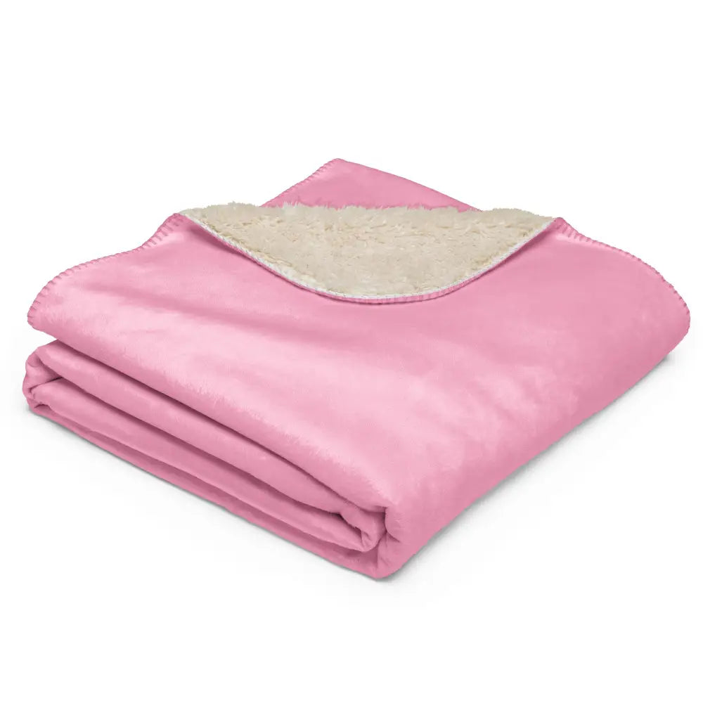 Light pink sherpa blanket with soft pink plush exterior and cream-colored sherpa lining for cozy warmth