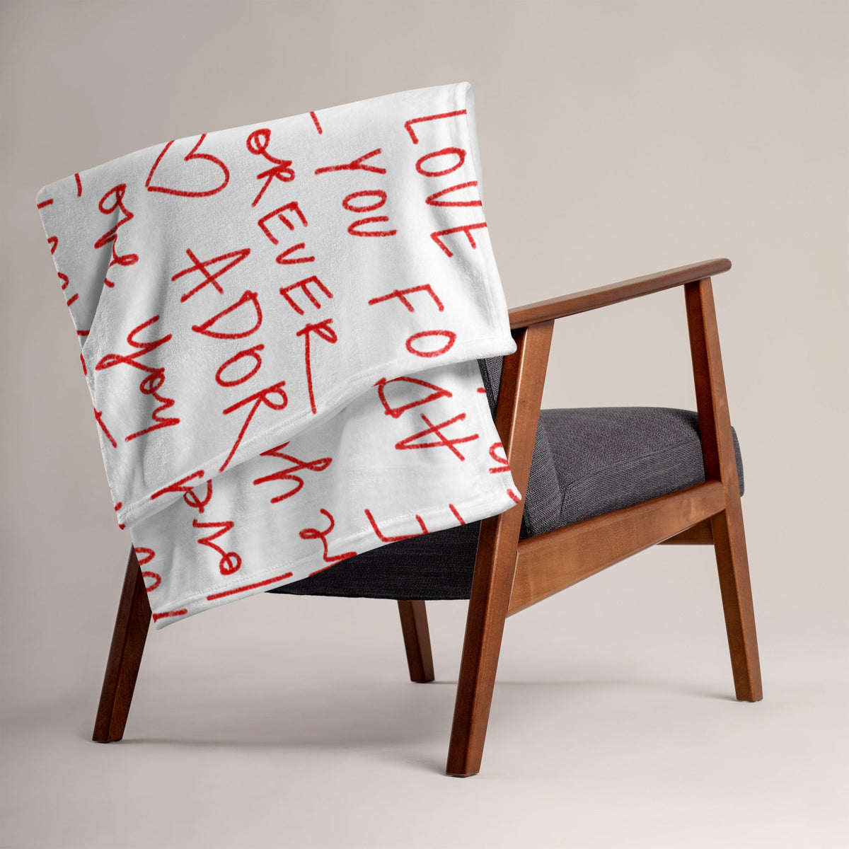White throw blanket with red handwritten-style text and heart symbols called love letter blanket for cozy use