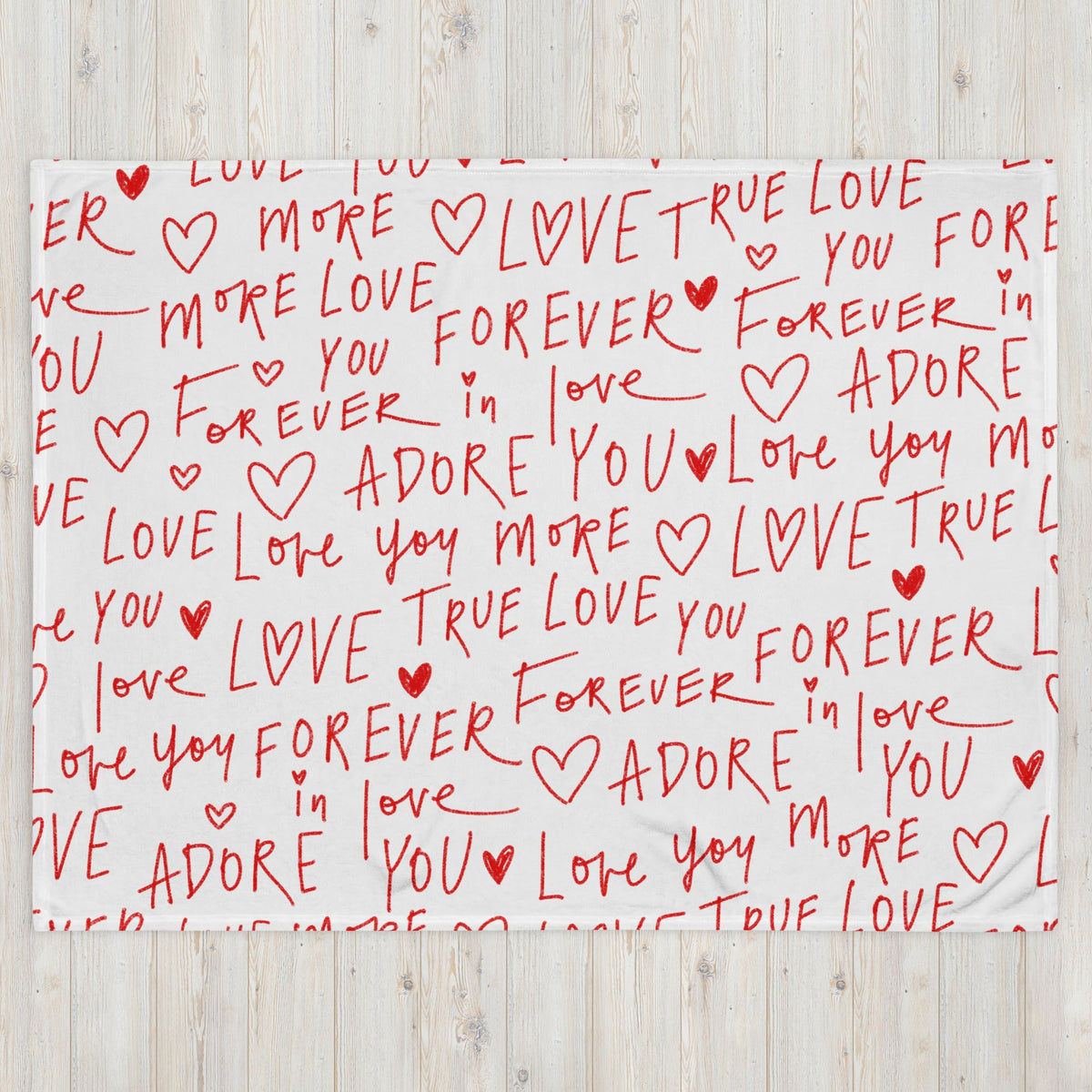 White love letter blanket featuring red handwritten style text and hearts with love forever and adore phrases
