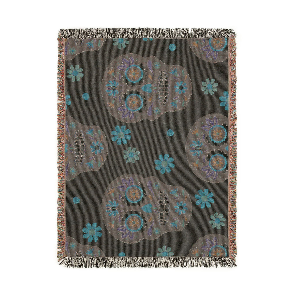 Dark gray mexican woven blanket with sugar skull pattern in teal purple and orange and decorative fringes on all edges