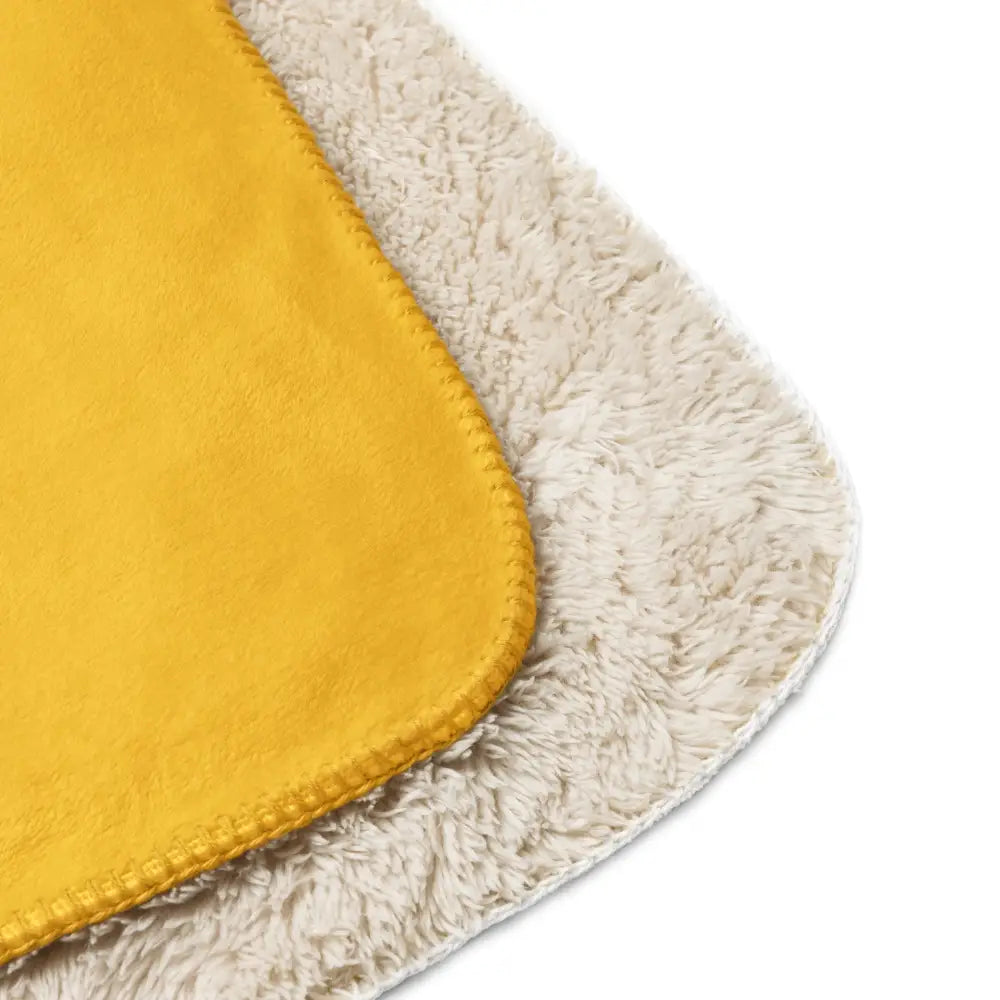 Mustard sherpa blanket with yellow fleece exterior and plush white sherpa lining for cozy warmth and comfort