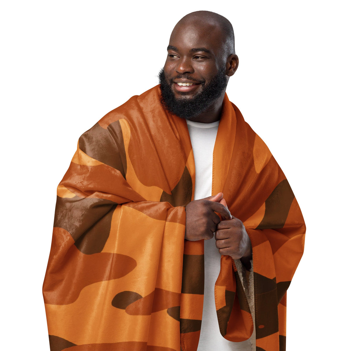 Orange camo blanket with brown camouflage pattern draped over a man’s shoulders showcasing the front side