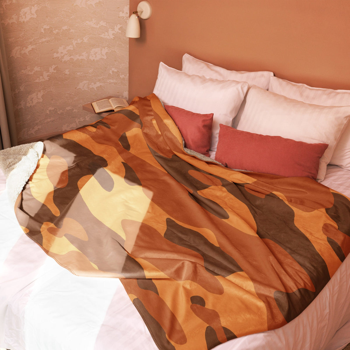 A cozy rust-orange and brown camouflage blanket with a soft plush texture perfect for warmth and comfort