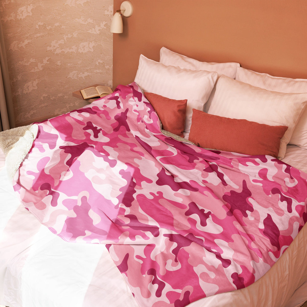 A soft pink camo blanket with a plush cozy texture perfect for warmth and comfort