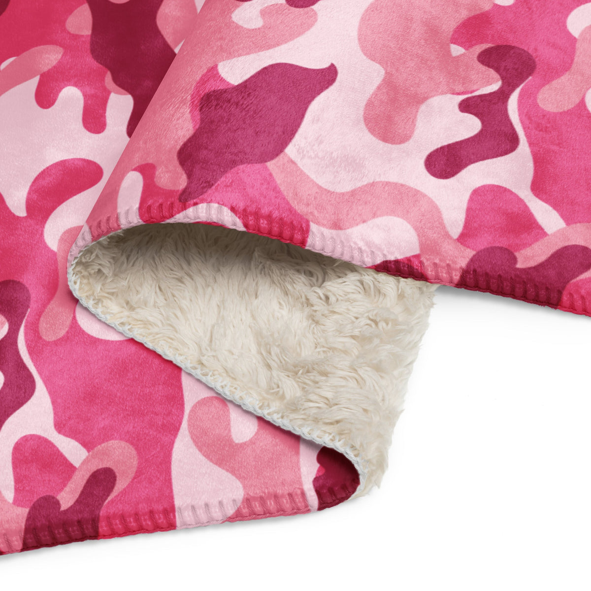 Pink camo blanket with camouflage fleece exterior and plush white sherpa lining for cozy warmth and comfort