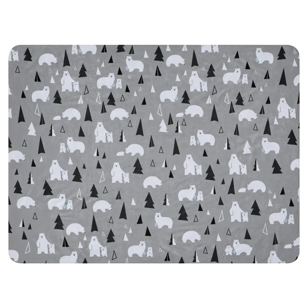 Gray polar bear sherpa blanket with white polar bears and black trees on a soft cozy textured mat surface