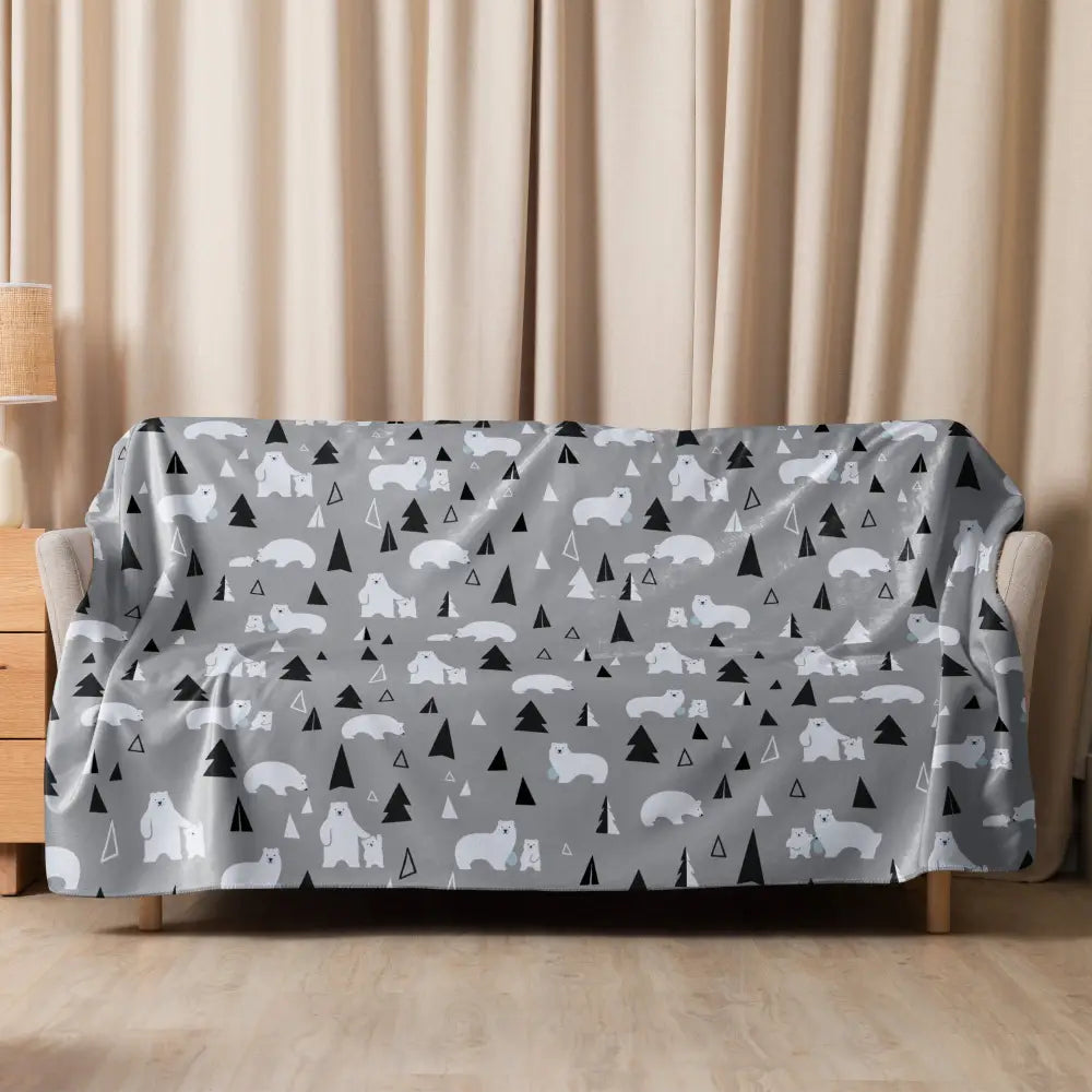 Gray polar bear sherpa blanket with playful white polar bears and black triangular trees pattern