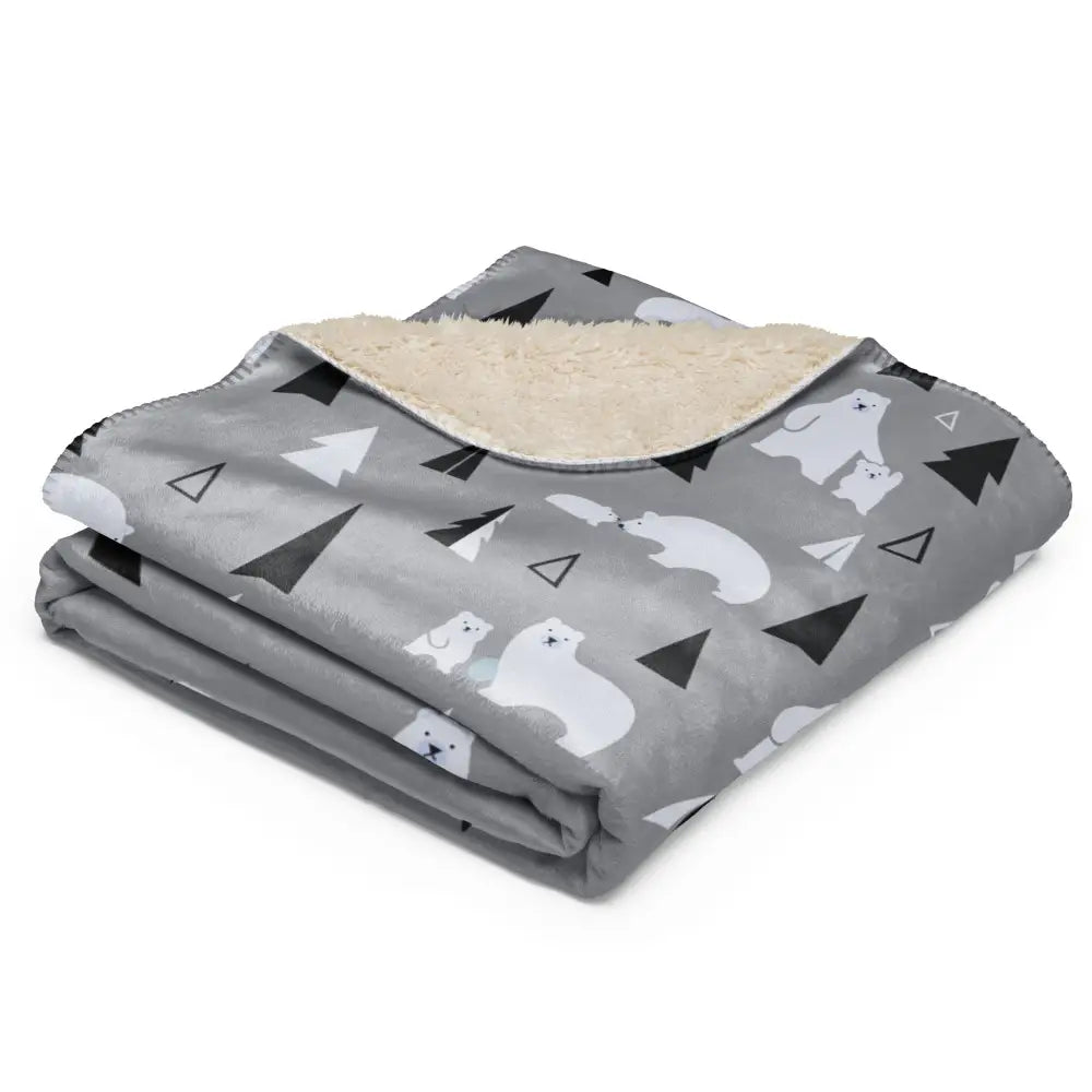 Gray fleece polar bear sherpa blanket with white and black patterns and plush beige sherpa lining for warmth