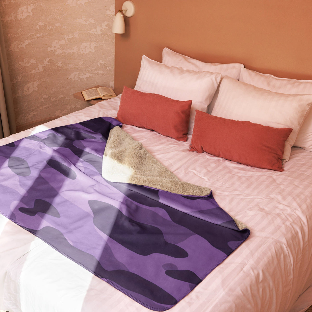 Purple camo throw blanket with purple and black camouflage pattern and soft fuzzy beige lining for cozy warmth