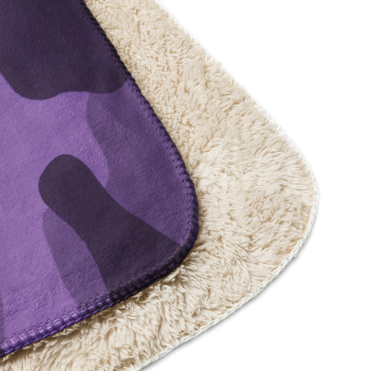 Purple camo throw blanket with purple and black camouflage fleece and cream sherpa lining for cozy warmth