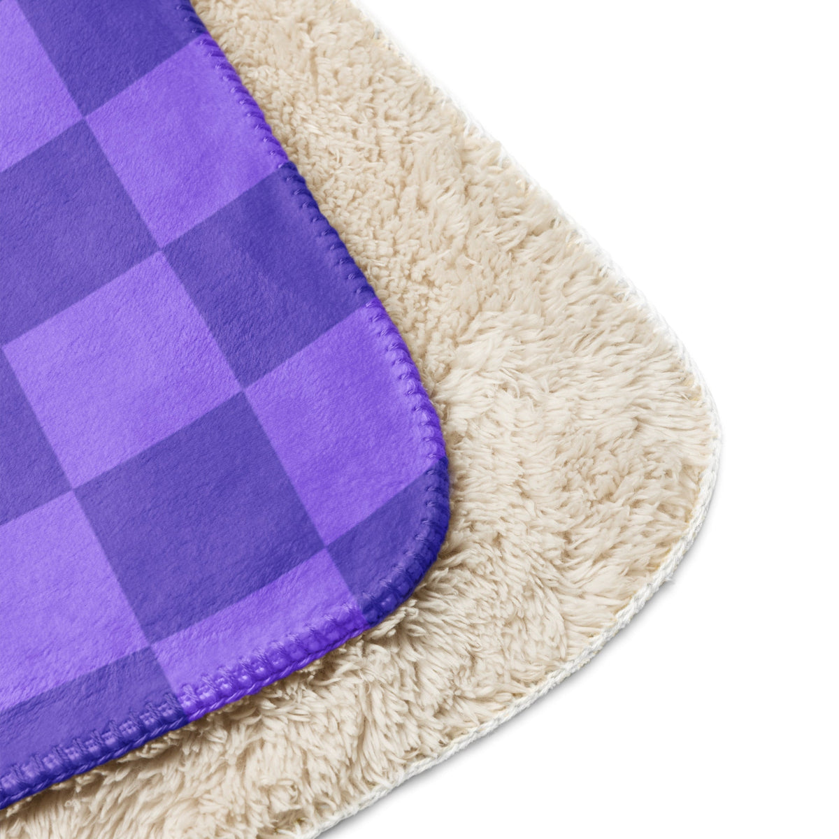 Purple checkered blanket with a plush cream-colored sherpa lining for cozy warmth and comfort