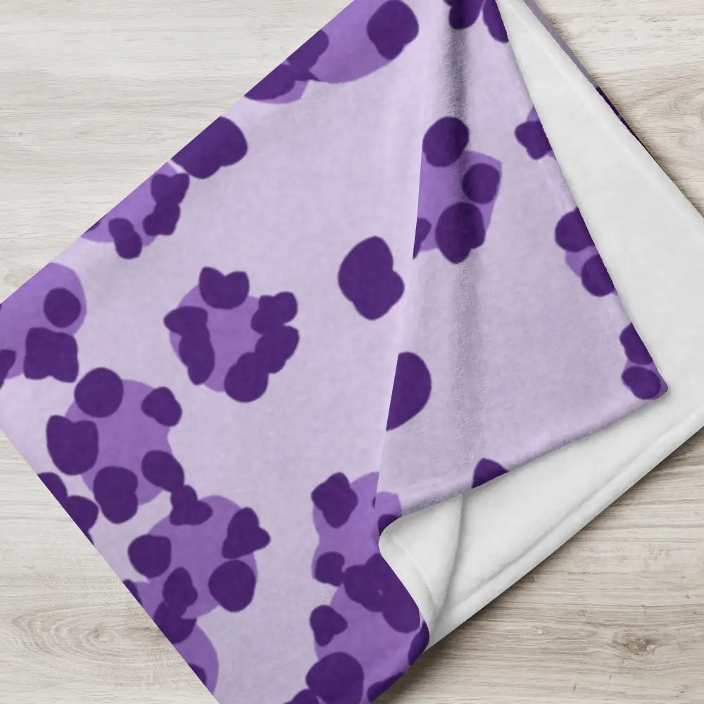 A soft lavender purple leopard print blanket with a plush white interior perfect for cozy warmth