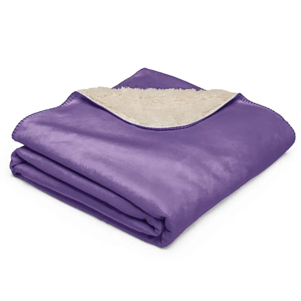 Purple sherpa throw blanket with soft purple fleece and cream-colored sherpa lining for cozy warmth
