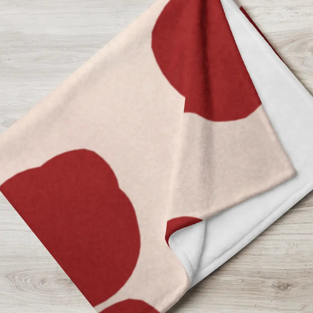 Plaid rouge et crème en tissu doux et moelleux avec un motif abstrait moderne de cercles rouges sur fond beige