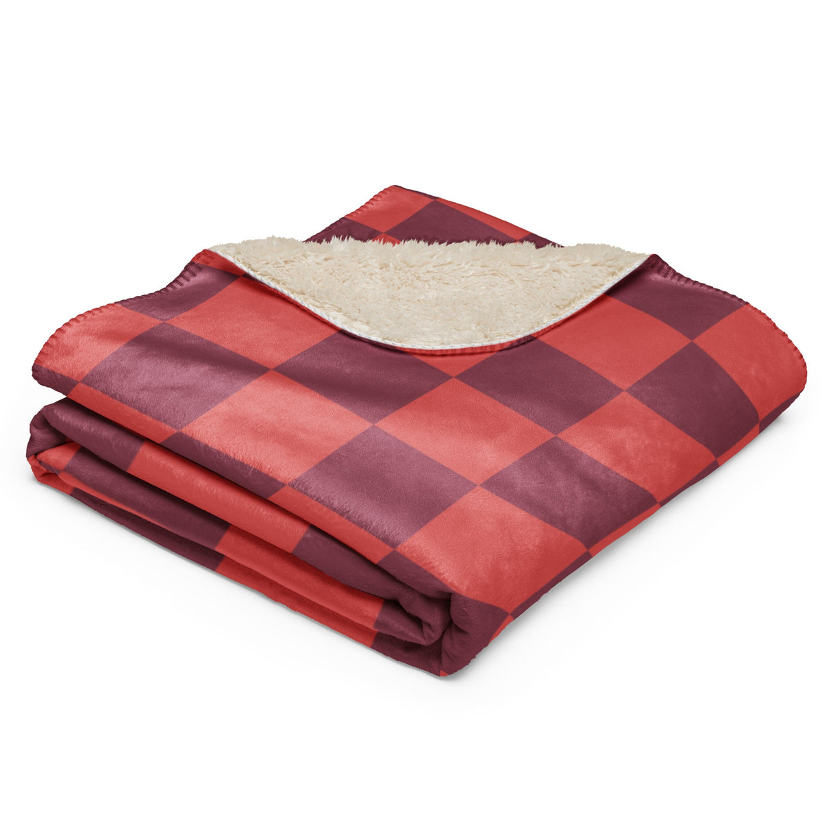 Red checkered blanket with red and maroon plaid exterior and plush cream-colored fleece interior for warmth