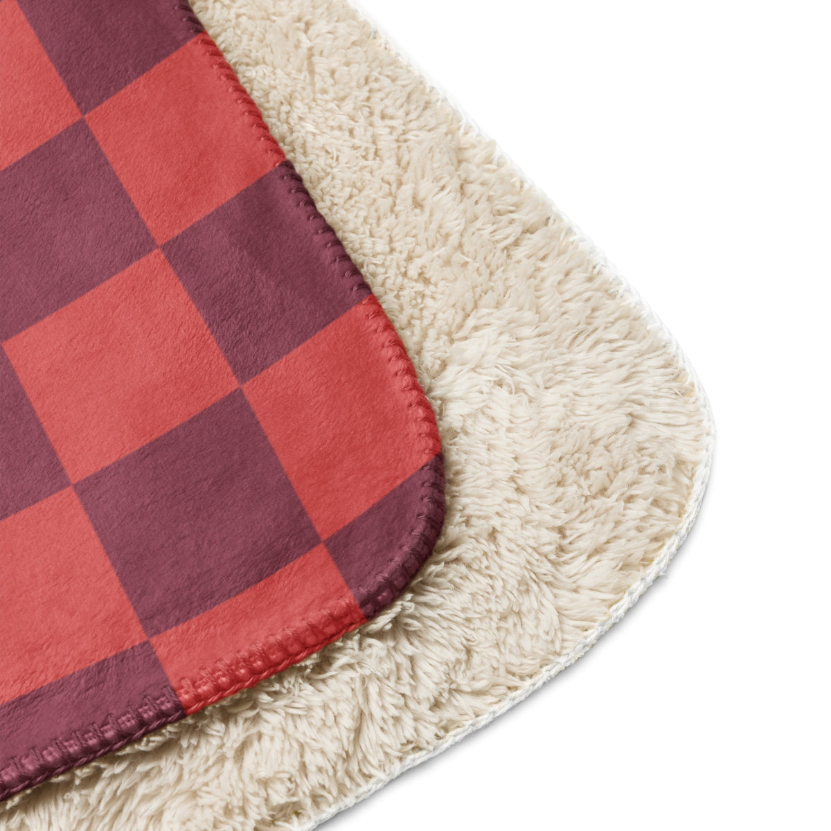 Red checkered clanket fleece blanket with red and maroon plaid design and plush cream sherpa lining