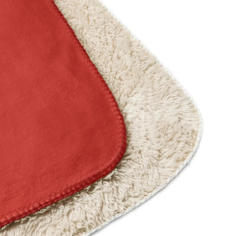 Red sherpa blanket with red and cream fleece and soft plush texture for cozy warmth and comfort