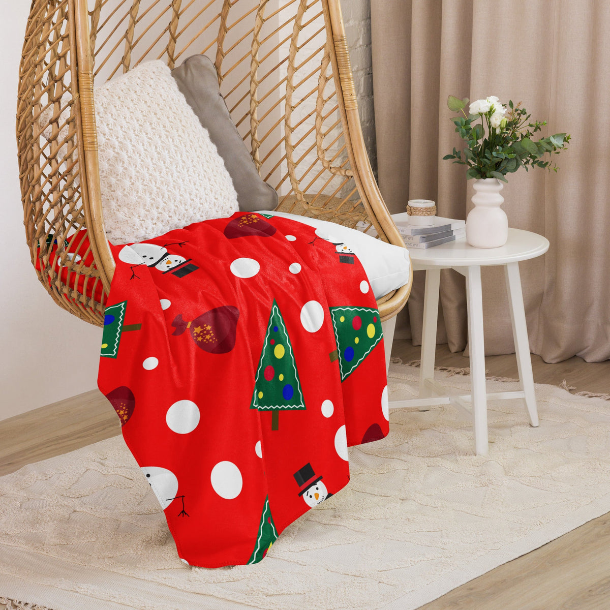 Red snowman christmas blanket with festive snowmen, decorated trees, and white polka dots for holiday use