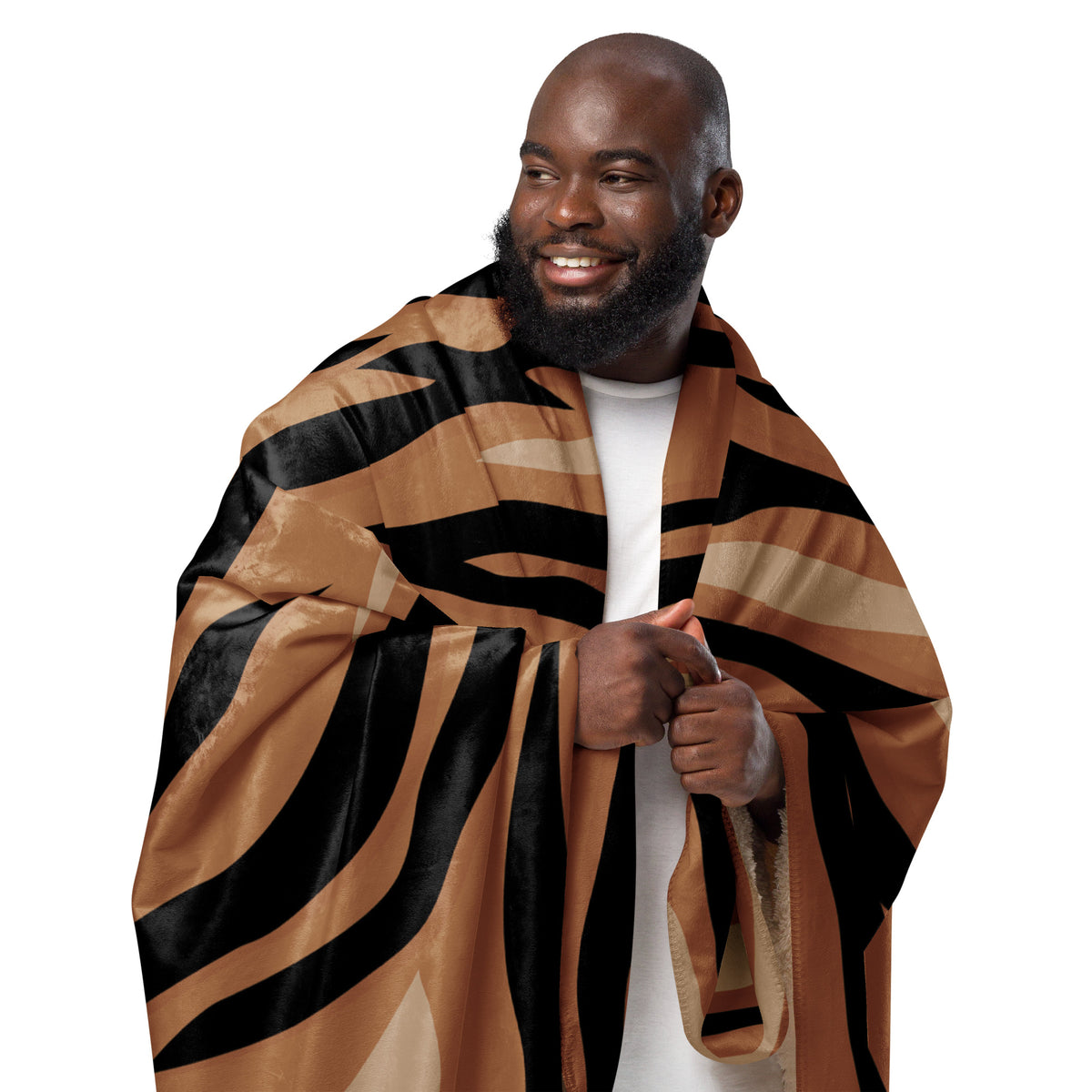 A plush brown tiger blanket with bold black and tan stripes perfect for cozying up at home