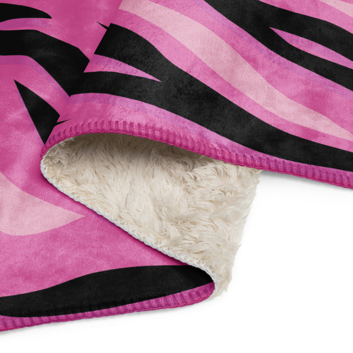 Pink tiger blanket fleece blanket with pink and black zebra stripes and plush white interior for cozy warmth