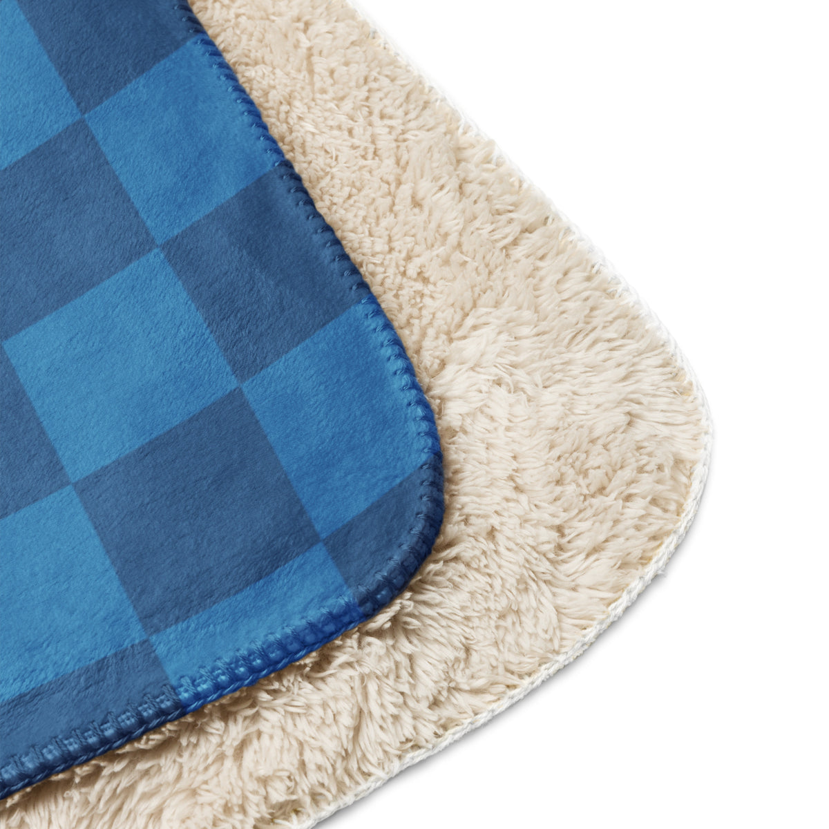 Blue checkered blanket in blue and cream plaid fleece with soft plush texture for cozy warmth and comfort