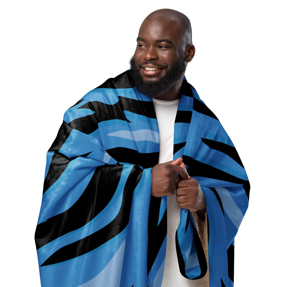 Blue tiger blanket with bold blue and black zebra-like stripes made of soft cozy material for warmth and comfort