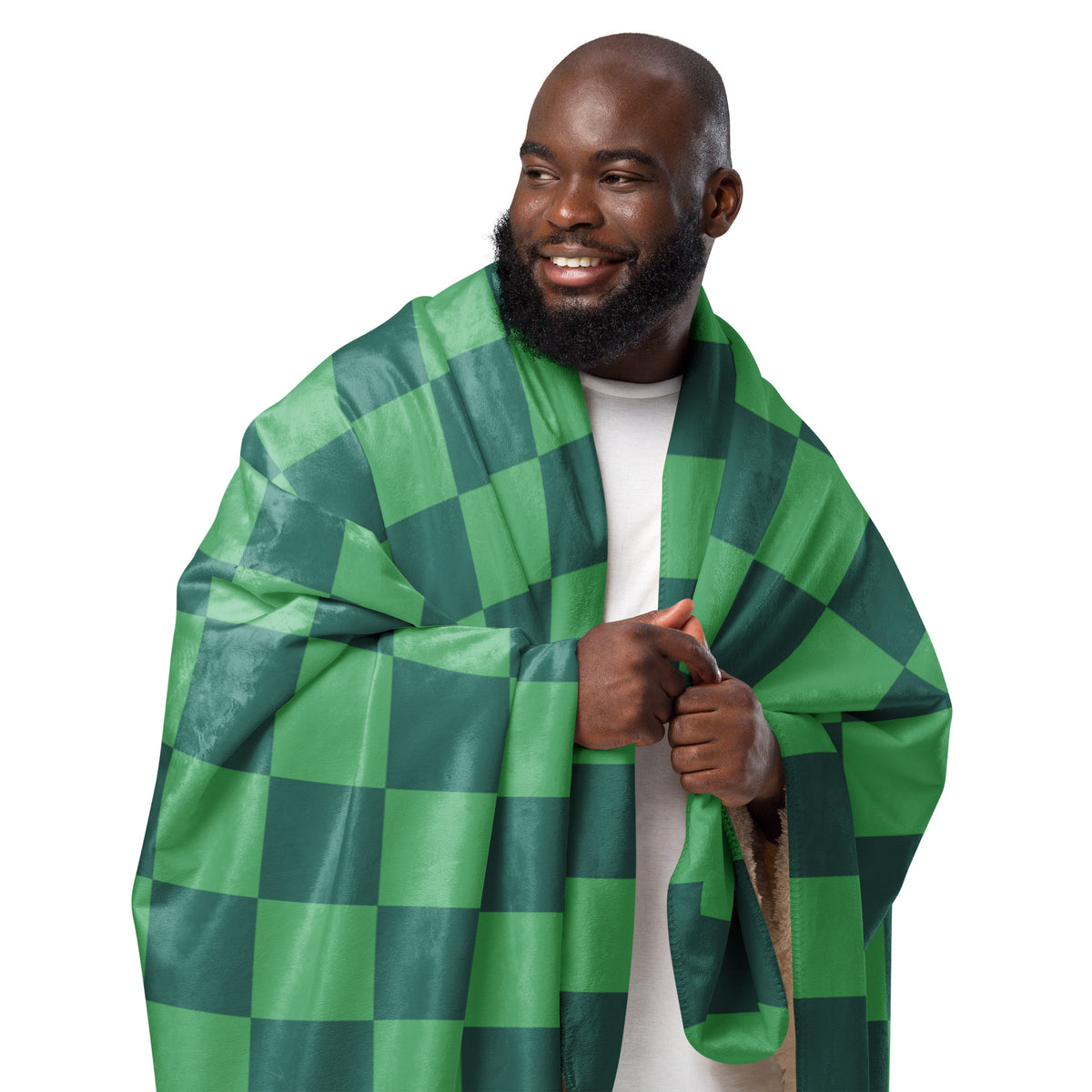 Green checkered blanket made of soft fabric featuring green and dark green checkered pattern for cozy use