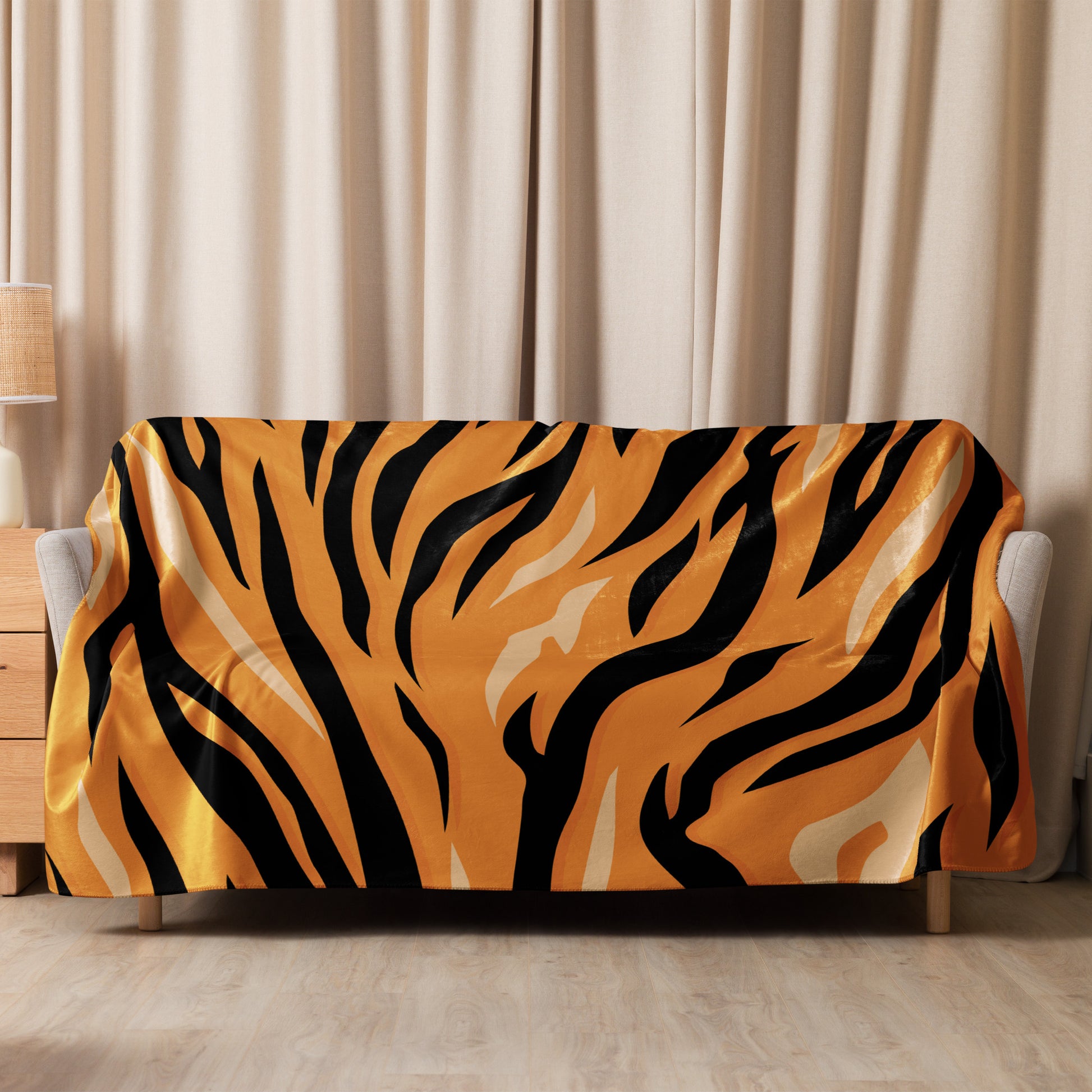 Orange tiger blanket featuring a vibrant orange and black tiger-striped satin sofa cover with a glossy finish