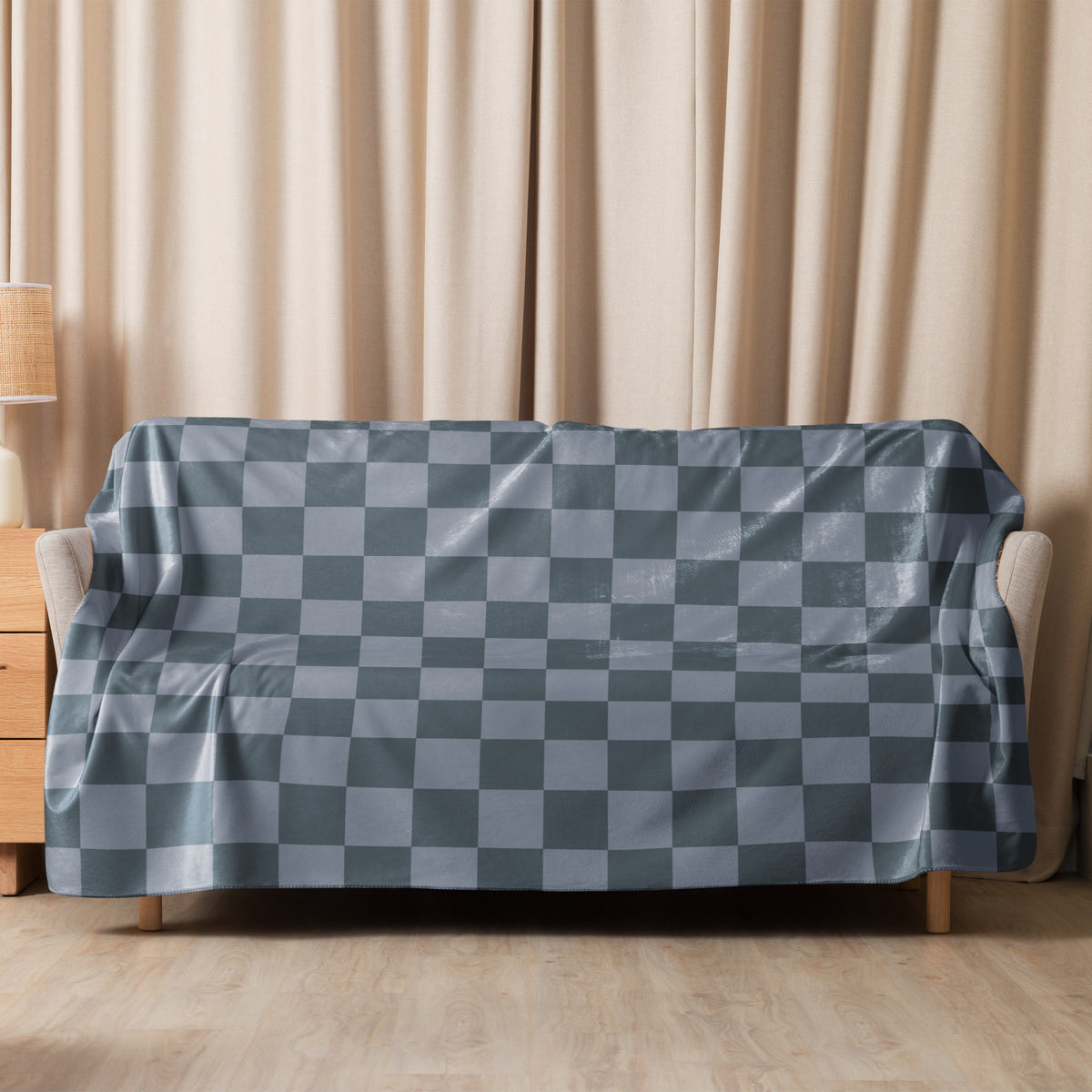 Grey checkered blanket featuring a gray and light blue checkered sofa cover with a glossy waterproof finish