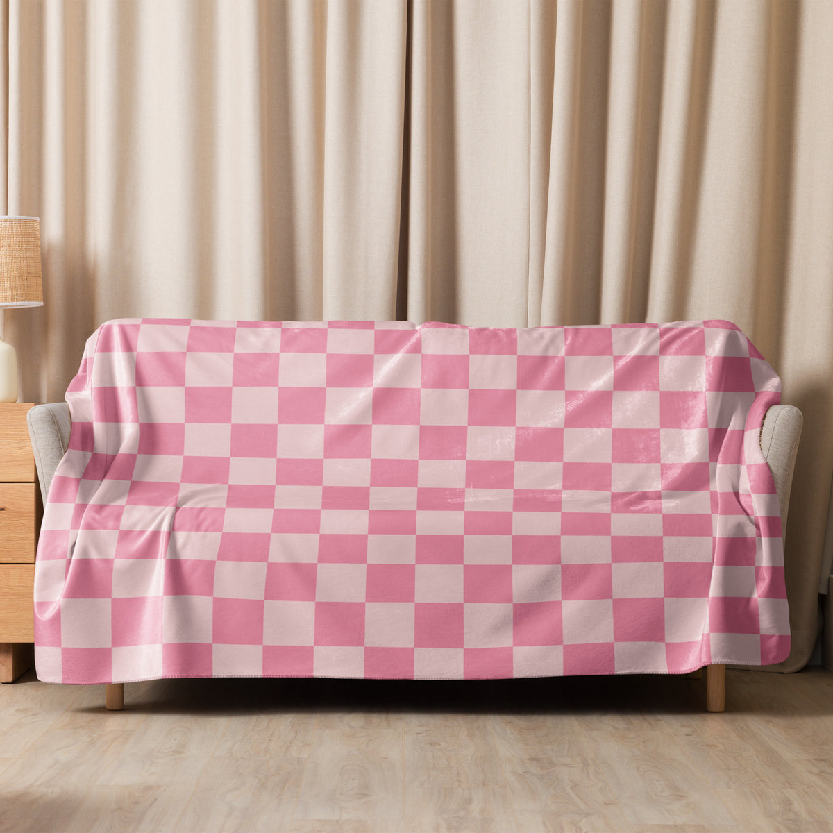 Pink checkered blanket featuring a pink and white checkered sofa cover made of soft fabric for home decor